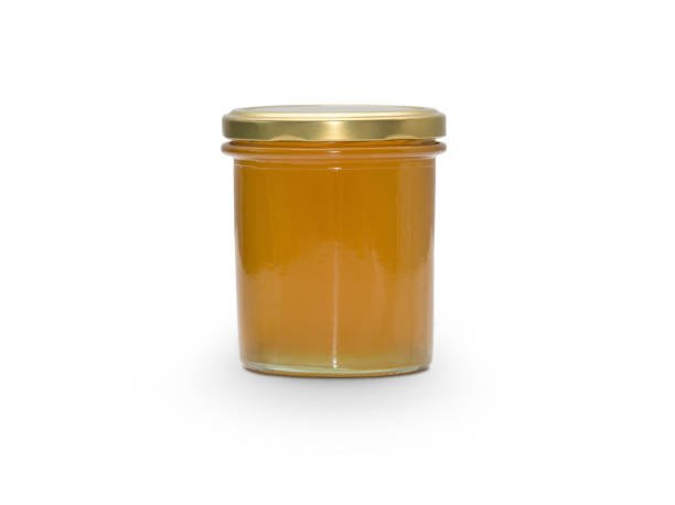 istock Glass of liquid honey 863482302