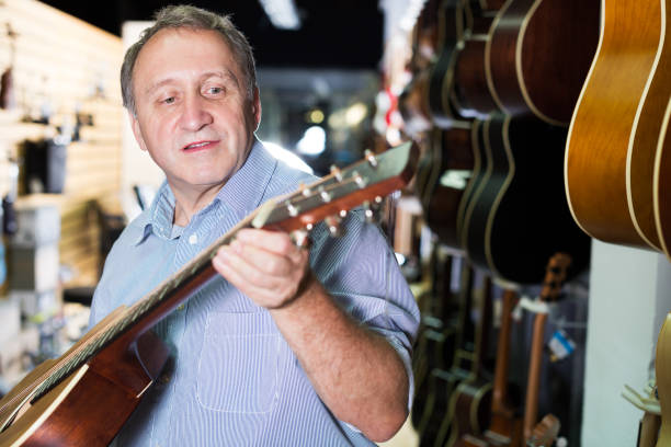istock male is standing with modern guitar 863486224