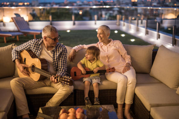 istock Grandpa, I am playing a guitar just like you! 863488664