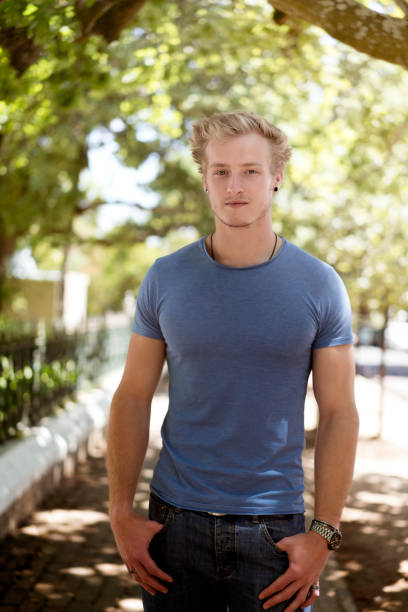 istock Portrait of man standing with hands in pockets 863491892