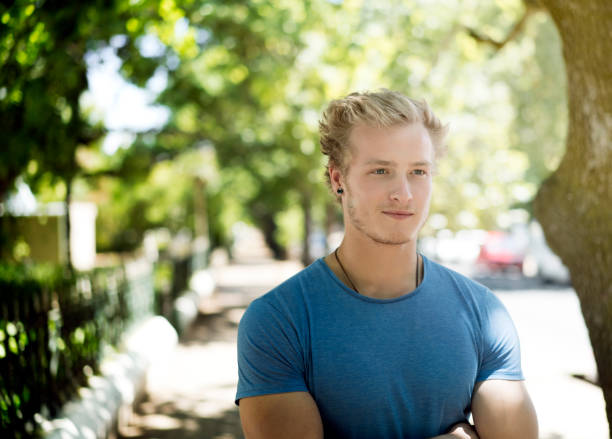 istock Thoughtful man standing with arms crossed 863492704