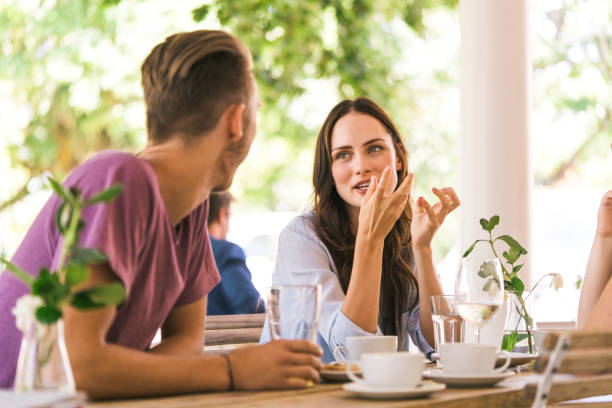 istock Woman talking to friend while sitting at table 863492710