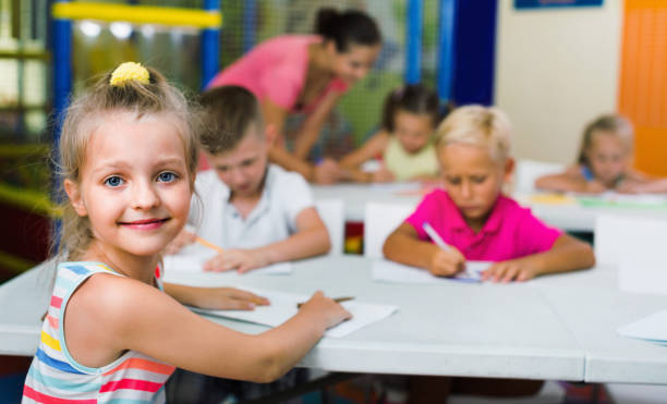 istock Portrait  pupil girl studying in school class 863497774