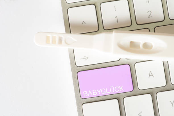 istock A computer with the baby happiness button and a pregnancy test 863505088