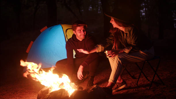 istock Young couple camping in forest 863505394