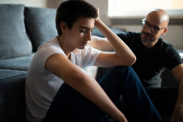 hearing a father's advice - teenager parent father son imagens e fotografias de stock