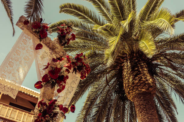istock Decorated Cross and Palm tree for holy cross day 863509448