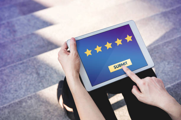 istock Customer Experience Concept, Best Excellent Services Rating for Satisfaction present by Hand of Client pressing Submit Button for Five Star on Digital Tablet 863511966