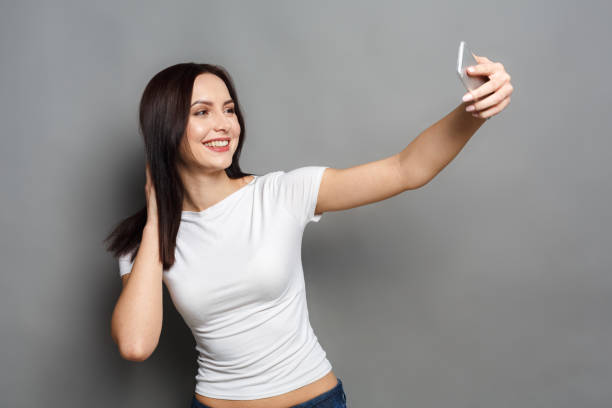 istock Woman taking photo with gadget, communication 863517406