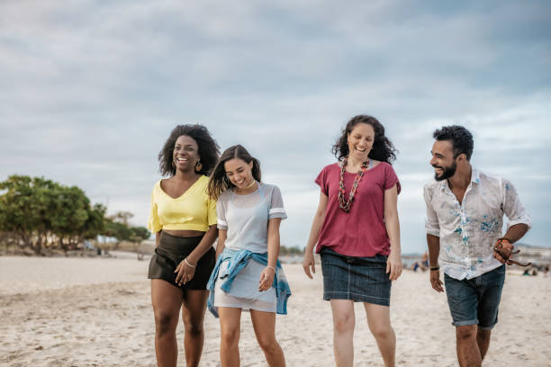 istock brazilian friends walking side by side at beach in Rio 863519898