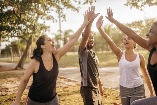 istock four brazilian friends cheering at beach at sunset hour 863520306