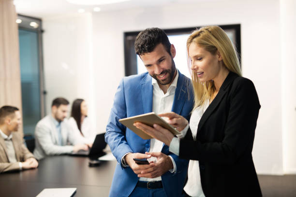 istock Portrait of attractive business partners using tablet 863520704