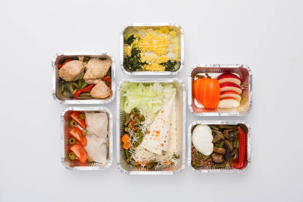 istock Healthy food in boxes, diet concept. Several containers isolated on white top view 863520742