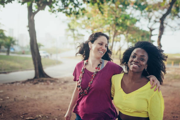 istock two brazilian girlfriends walking embraced at beach in Rio 863521628