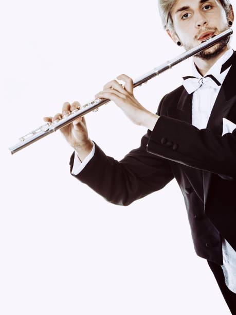 istock Male flutist wearing tailcoat plays flute 863523794