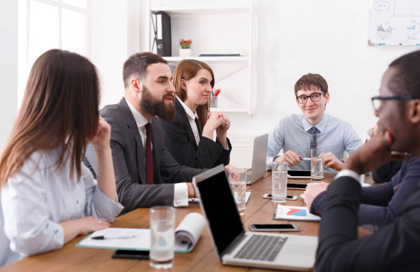 istock Dealing meeting manager with employees. Friendly atmosphere, emotionally discussion. 863523798