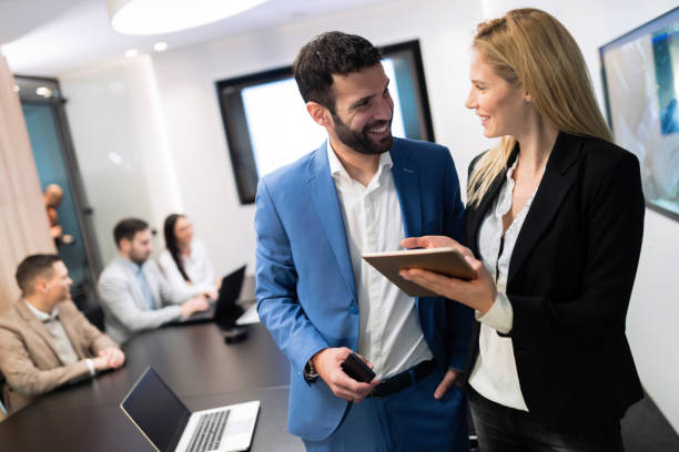 istock Attractive business couple using tablet in their company 863524336