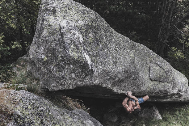 istock Man practicing boulder rock climbing in the Pyrenees Catalonia 863524562