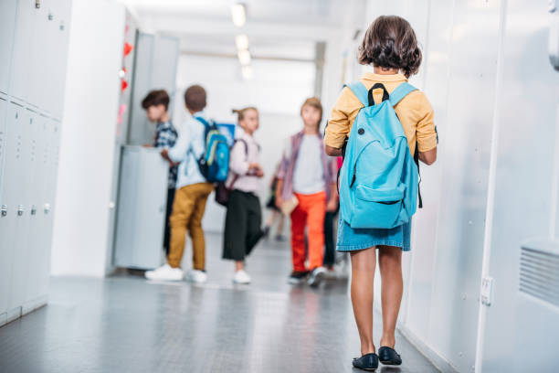 istock girl with backpack in school 863527910
