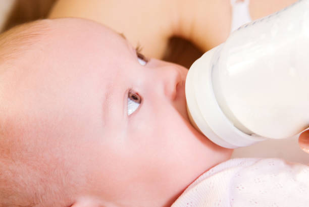 istock A baby eating milk from bottle 863528278