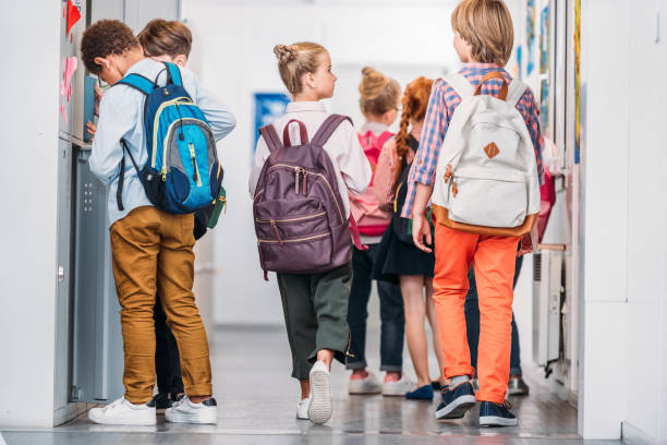 istock kids in school corridor 863529374