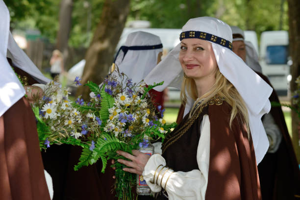 Munich, Germany  - September 22, 2013: on the float of grand oktoberfest parade of regional costums a woman of the group \