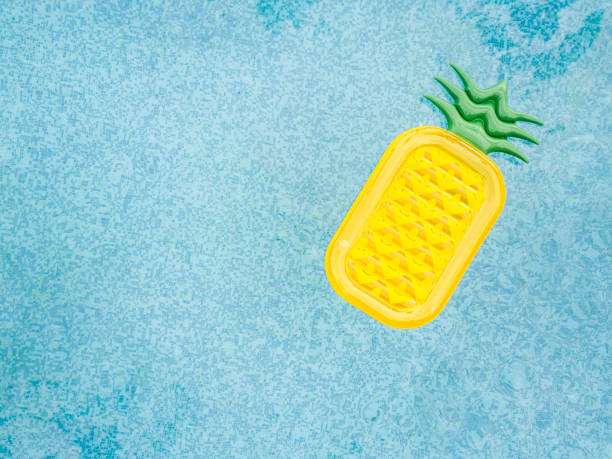 inflatable pineapple on pool - inflatable raft imagens e fotografias de stock