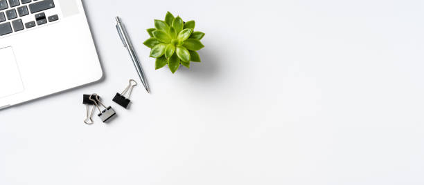 Overhead shot of office accessories on white background