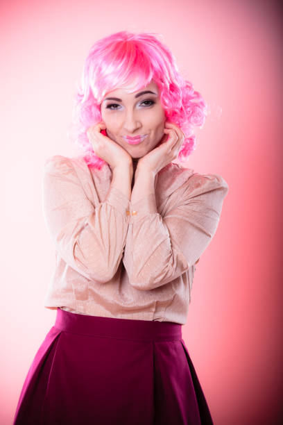 istock woman with pink wig creative visage 863559372