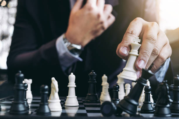 istock Close up of hands confident businessman colleagues playing chess game to development analysis new strategy plan, leader and teamwork concept for success. 863564856