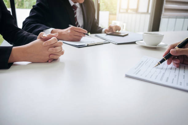 istock Interviewer or Board reading a resume during a job interview, Employer interviewing a young male job seeker for recruitment talking in modern office, employment and recruitment concept 863565002