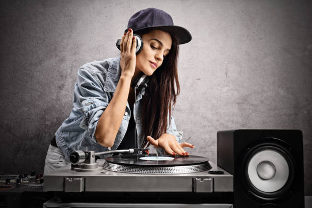 istock Female DJ playing music on a turntable 863565024