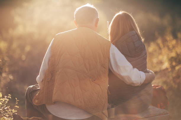 istock Happy senior couple camping in forest 863565042
