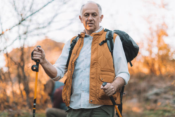 istock Senior man on a hiking trip looking at the camera 863565838