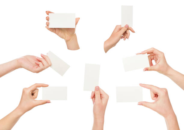 istock White female hand with business cards. Set, isolated on white. 863569376