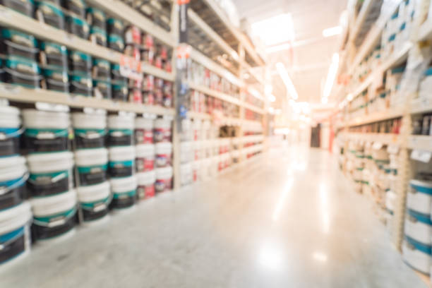 istock Blurred rack of paint cans in home improvement hardware store USA 863569636