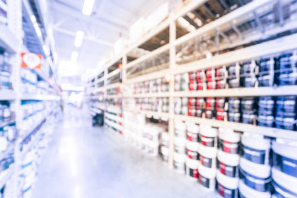 istock Blurred rack of paint cans in home improvement hardware store USA 863572584