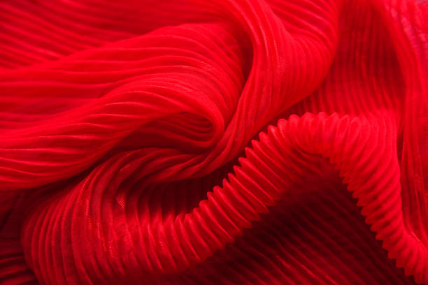 istock The texture of the pleated fabric. Red georgette fabrics. 863573010