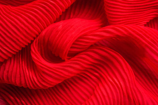 istock The texture of the pleated fabric. Red georgette fabrics. 863573258