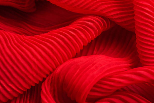 The texture of the pleated fabric. Red georgette fabrics.