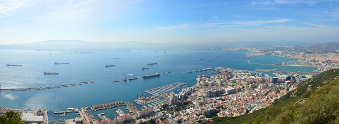 Gibraltar: panorama of the town and the port, with La Linea on the right and Algecerias and its bay in the background - view from the Upper Rock Nature reserve - photo by M.Torres