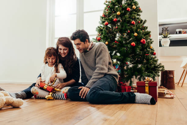 istock Family celebrating Christmas at home. 863577948