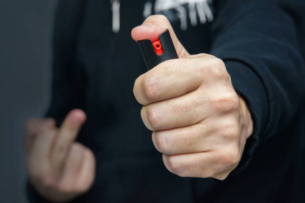istock Hand with bottle of pepper spray 863578272