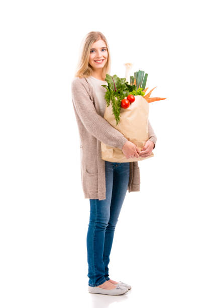 istock Beautiful woman carrying vegetables 863583412