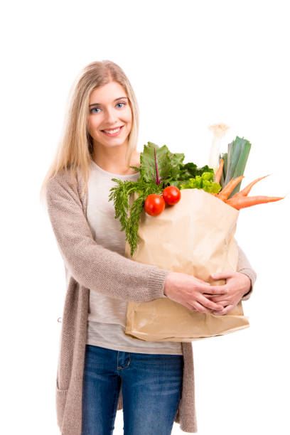 beautiful woman carrying vegetables - 45876 imagens e fotografias de stock