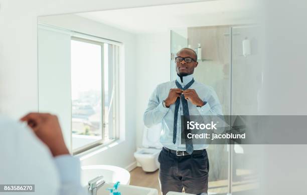 Man Getting Ready For Office Stock Photo - Download Image Now - Mirror - Object, Getting Dressed, Preparation