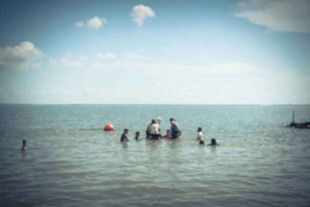 istock Blurred people on beach La Porte, Texas, USA 863587536