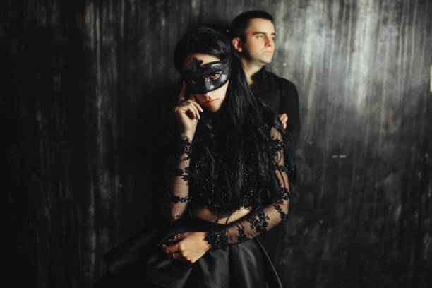 istock woman  with  theatrical mask and handsome man 863587662