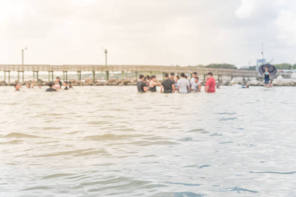 istock Blurred people on beach La Porte, Texas, USA 863591928