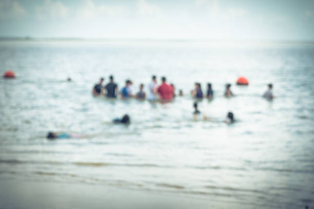istock Blurred people on beach La Porte, Texas, USA 863592018